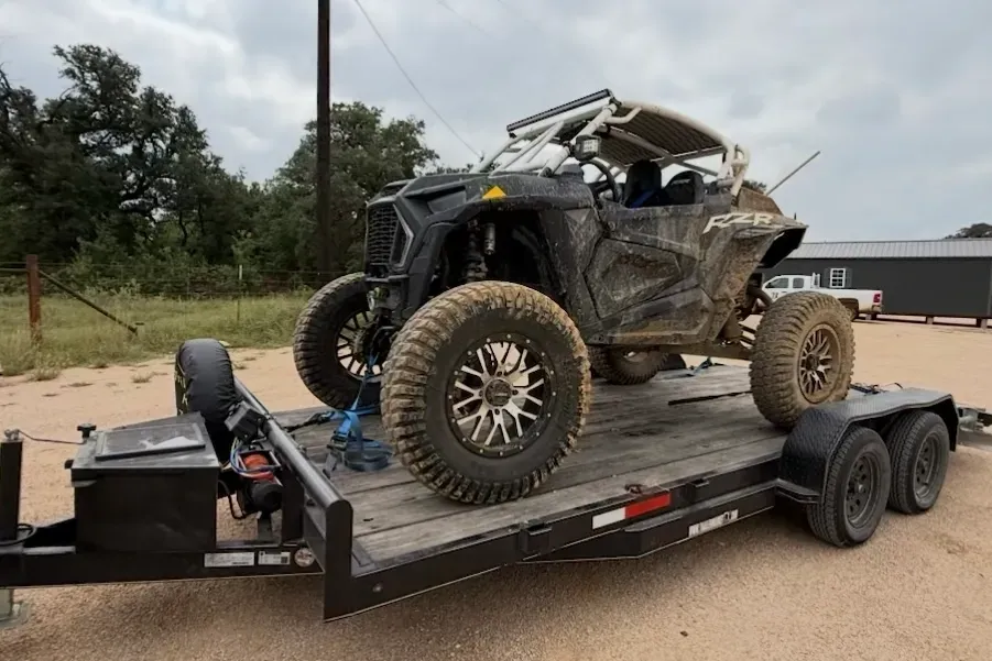 Car hauler trailer with UTV loaded